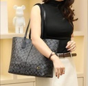 Cartera Coach de cuero para mujer.