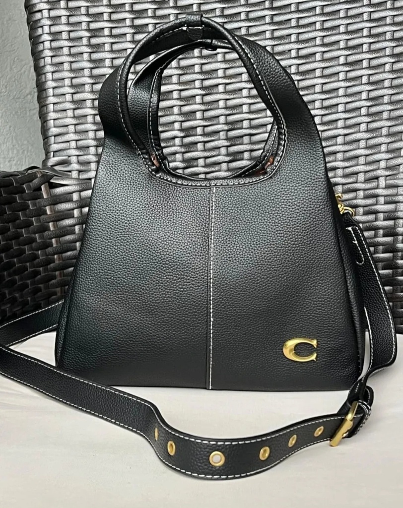 Cartera COACH de mano para mujer.