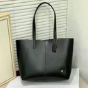 Cartera Coach de cuero para mujer.